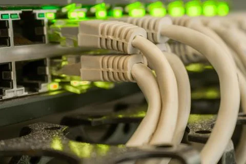 Many Internet cables are  in the server room of the data center. Bunch of pat 库存照片