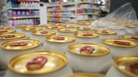 Many iron cans with beer in the store. Stock Footage 298029279