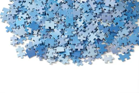 Many jigsaw puzzle pieces on white background. Foto stock