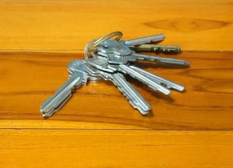 Many keys on table Stock Photos