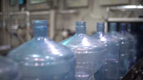 Many large plastic bottles on the conveyor. Production Stock-Footage 68639148