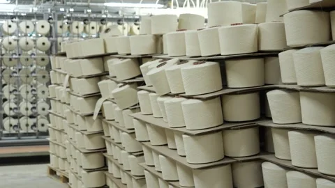 Many large spools of thread in weaving textile factory warehouse close-up Stock Footage 271616101