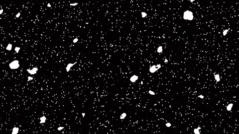 Many large white irregular blobs scattered across black starry night background. Stock Footage 336655015