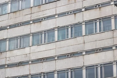 Many large windows on the facade of the building Stock Photos