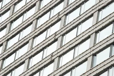 Many large windows on the facade of the building. Selective focus. Stock Photos