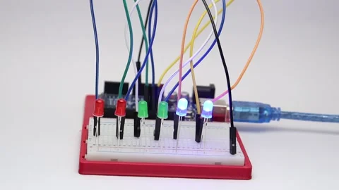 Many LED lights are connected on breadboard controlled by controller Stock Footage 334123110