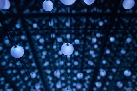 Many light bulbs that go down with their cables Stock Photos