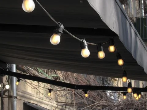 Many light bulbs on the wire Stock Photos