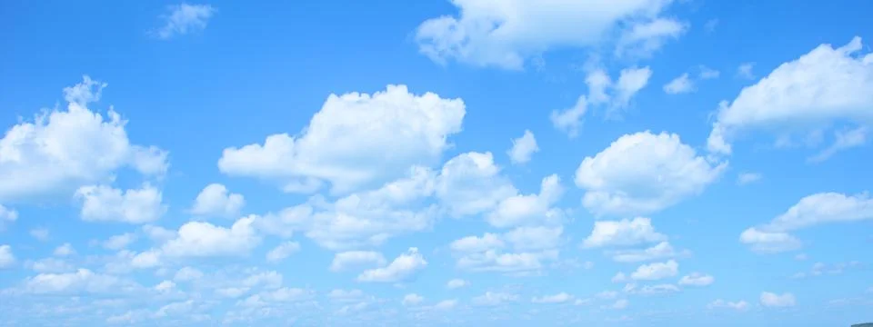 Many little fluffy clouds in blue sky in summer Stock Photos