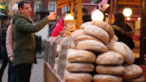 Many loaves of bread are sold at the market counter. Stock Footage 140642302