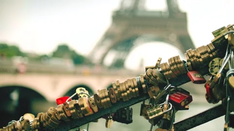 Many love locks or padlocks as love symbols at the Eiffel Tower, Paris Video stock 245981590