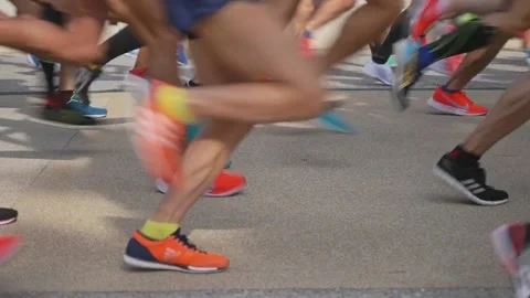 Many marathon runners running fast, leg shot Stock Footage 152246578