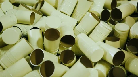 Many metal caps for wine bottles. Conveyor on the production of alcoholic Stock Footage 99252736