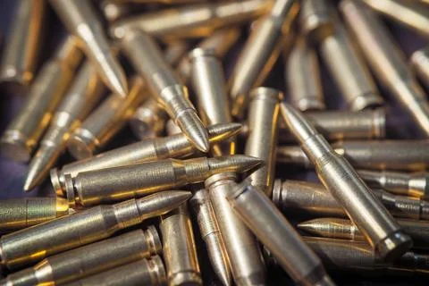 Many metalic bullets on background. Foto stock