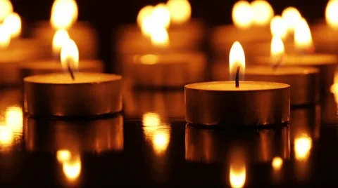 Many Mini burning candles closeup Stock Footage 57276541