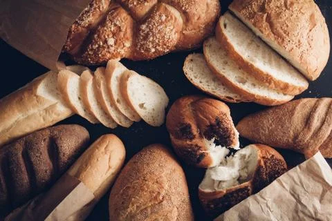 Many mixed breads and rolls shot from above Stock Photos