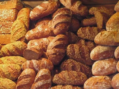 Many mixed breads and rolls background Stock Photos