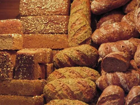 Many mixed breads and rolls background Foto stock