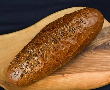Many mixed breads and rolls shot from above. Top view of assortment of differ Stock Photos