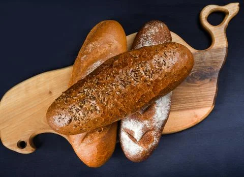 Many mixed breads and rolls shot from above. Top view of assortment of differ Foto stock