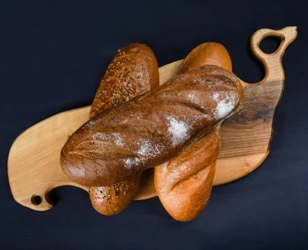 Many mixed breads and rolls shot from above. Top view of assortment of differ Stock Photos