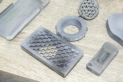 Many models gray printed on 3D printer. Gray objects printed on 3D printer Stock Photos