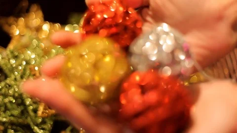 Many multi-colored Christmas sparkling Christmas toys in a basket. Video stock 70797626