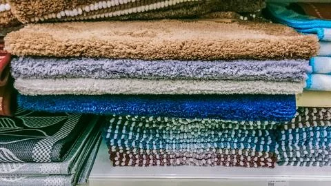 Many multi-colored feathered floor mats Stock Photos