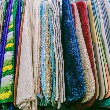 Many multi-colored feathered floor mats Stock Photos