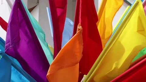 Many multi-colored flags in the wind. Multi-colored small flags. 스톡 동영상 131176790