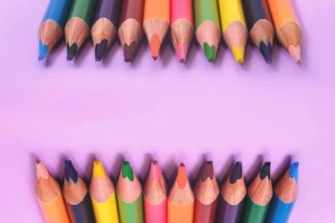 Many multi colored on the purple background. Stock Photos