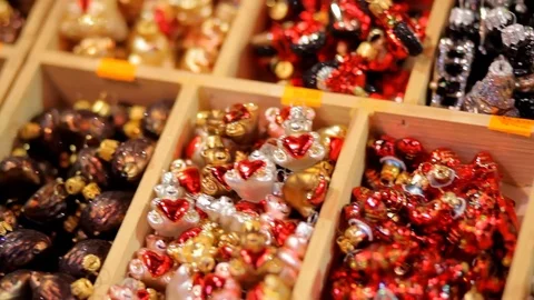 Many multi-colored sparkling Christmas tree decorations in box. Stock Footage 70797271