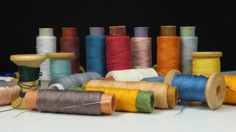 Many multi-colored spools of threads Stock Footage 319905607