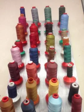 Many multi-colored threads for sewing. skeins with thin threads. Stock Photos