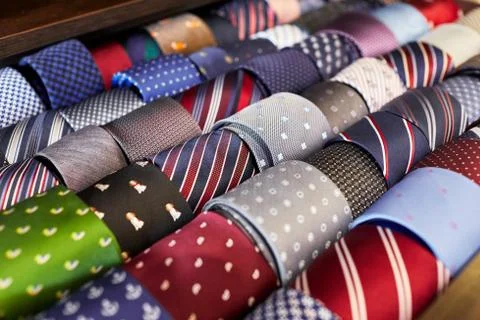 Many multi-colored ties lying in a row Stock Photos