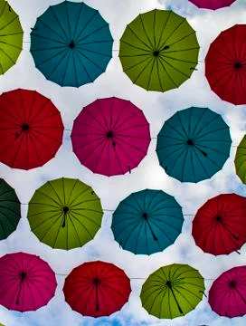 Many multi-colored umbrellas on a background of sky in Guangzhou, China Foto stock