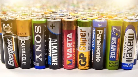 Many multi-colored used AA batteries from various manufacturers Video stock 127188540