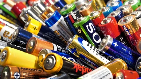 Many multi-colored used AA batteries from various manufacturers Video stock 127188586