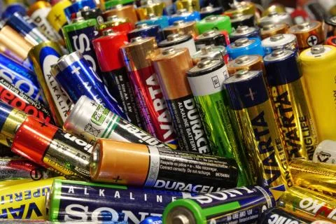 Many multi-colored used batteries from various manufacturers Stock-Fotos