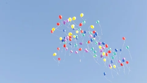 	 many multicolor helium balloons flying in the blue sky. Holidays or paty conce Stock Footage 121303603