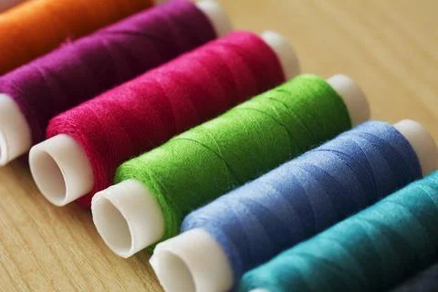 Many multicolor sewing threads, Yarn textile, Spool. 스톡 사진