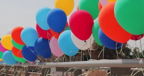 Many multicolored balloons at wind Stock Footage 94535726