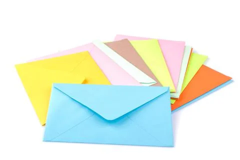 Many multicolored postal envelopes on a white isolated background. mail conce Stock Photos