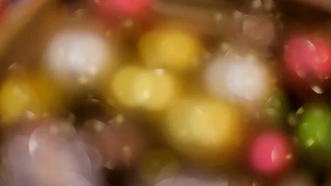 Many multicolored sparkling Christmas tree decorations in box. Stock Footage 70741860