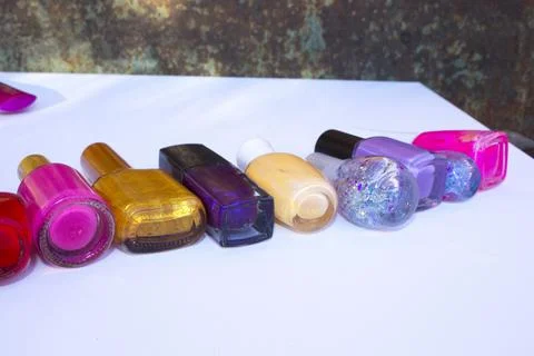 Many nail varnish bottles on the table Stock Photos