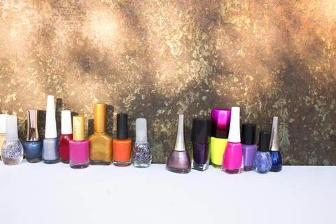 Many nail varnish bottles on the table Stock Photos