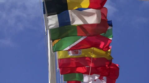 Many nation flags blowing breeze with blue sky Video stock 40776196