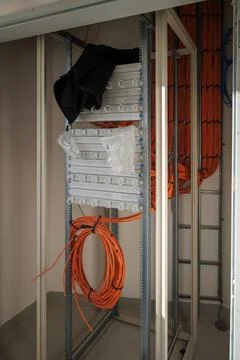 Many network cables run in a new building to a server cabinet Stock Photos