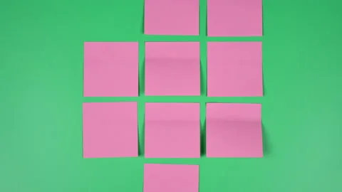 Many note paper on a green background - Stop Motion Animation. 動画素材 197016807