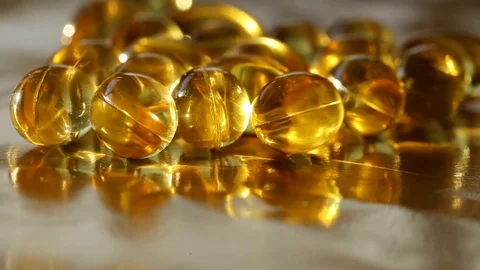 Many oil capsules Stock Footage 72033299